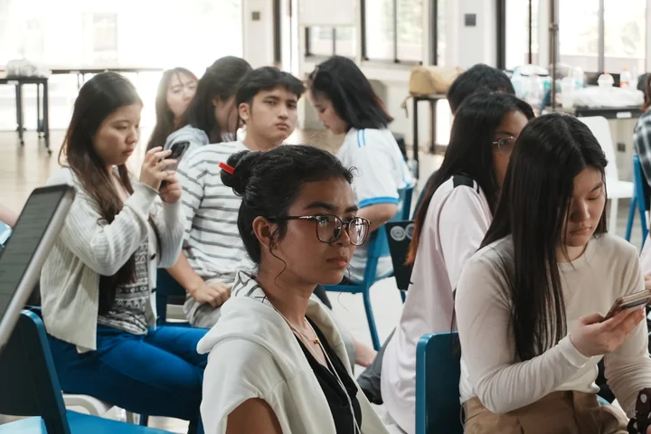 IDFC2026 participants listening during a session