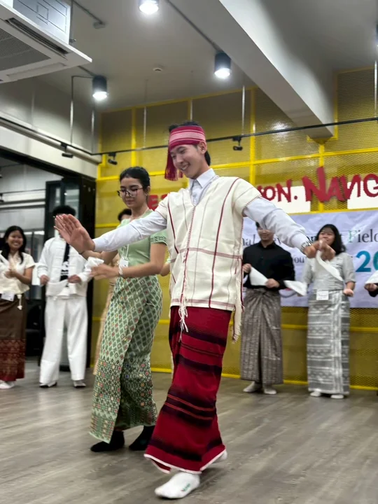 IDFC2026 participants dancing in traditional clothing